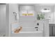 Relaxing bathtub in bathroom with white tile, a window, and white walls at 3625 Bailey Lake Dr, Fuquay Varina, NC 27526