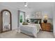 Inviting bedroom featuring a cozy bed with decorative pillows, bedside tables with lamps, and neutral decor at 3625 Bailey Lake Dr, Fuquay Varina, NC 27526