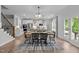 Open-concept dining area and kitchen featuring modern appliances, sleek countertops, and ample cabinet space at 3625 Bailey Lake Dr, Fuquay Varina, NC 27526