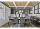 Beautiful dining room featuring coffered ceilings, elegant chandelier, and large windows for natural light at 3625 Bailey Lake Dr, Fuquay Varina, NC 27526