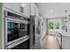 Kitchen with stainless steel appliances and view into the dining area at 3625 Bailey Lake Dr, Fuquay Varina, NC 27526