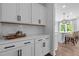 Kitchen servery with ample white cabinets, quartz counters, and access to the kitchen island at 3625 Bailey Lake Dr, Fuquay Varina, NC 27526