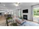 Spacious living room with fireplace flowing into the dining area and kitchen, perfect for modern living at 3625 Bailey Lake Dr, Fuquay Varina, NC 27526
