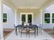 Covered patio features an outdoor dining area, ceiling fan, and views of the backyard at 3625 Bailey Lake Dr, Fuquay Varina, NC 27526