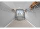 Bright walk-in closet with an ottoman, built-in shelving, and a window providing natural light at 3625 Bailey Lake Dr, Fuquay Varina, NC 27526
