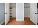 Open closet with shelving and wood floors at 3627 Nc 57, Hillsborough, NC 27278