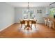Cozy dining area with a round table and French doors leading to the backyard at 3627 Nc 57, Hillsborough, NC 27278