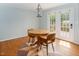 The dining area has a round wood table and chairs at 3627 Nc 57, Hillsborough, NC 27278