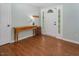Entryway features a wood floor and a coat rack next to the door at 3627 Nc 57, Hillsborough, NC 27278