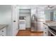 The kitchen features stainless steel appliances and a side-by-side refrigerator at 3627 Nc 57, Hillsborough, NC 27278