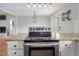 Open-concept kitchen features granite countertops, stainless steel range, and ample counter space at 3627 Nc 57, Hillsborough, NC 27278