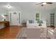 Inviting living room boasts wood floors, a ceiling fan, and great natural light at 3627 Nc 57, Hillsborough, NC 27278