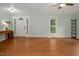 Open living room with beautiful wood floors, ceiling fan and lots of natural light at 3627 Nc 57, Hillsborough, NC 27278