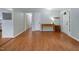 Open living room has beautiful wood floors and light walls at 3627 Nc 57, Hillsborough, NC 27278