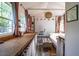Cozy shed interior featuring wooden counters, a day bed, and natural light from the windows at 3627 Nc 57, Hillsborough, NC 27278