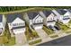 An aerial view of the homes with a nearby pond at 380 Garden Vine Trl, Raleigh, NC 27610