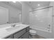 Bathroom featuring gray vanity, a framed mirror and a combined shower and tub at 380 Garden Vine Trl, Raleigh, NC 27610