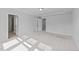 Spacious bedroom with neutral carpet, showcasing ensuite bathroom and walk-in closet at 380 Garden Vine Trl, Raleigh, NC 27610