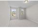 Cozy carpeted bedroom with great natural light from the two windows overlooking the neighborhood at 380 Garden Vine Trl, Raleigh, NC 27610