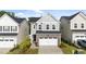 Charming two-story home featuring stone accents, a two-car garage, and manicured landscaping at 380 Garden Vine Trl, Raleigh, NC 27610
