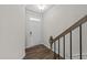 View of the front door with transom window and wood-look flooring at 380 Garden Vine Trl, Raleigh, NC 27610