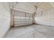 A spacious two-car garage with an automatic door and concrete floor, ready for vehicles and storage at 380 Garden Vine Trl, Raleigh, NC 27610