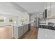 Bright, open kitchen with an island, stainless steel appliances and eat-in area at 380 Garden Vine Trl, Raleigh, NC 27610