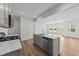 Kitchen with a central island, stainless steel appliances, and an open concept design at 380 Garden Vine Trl, Raleigh, NC 27610