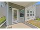 Back patio area featuring a door and window with siding at 380 Garden Vine Trl, Raleigh, NC 27610