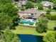 A large multi-story home with a backyard oasis featuring a pool, spa, and water features at 3829 Westbury Lake Dr, Raleigh, NC 27603