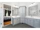 Elegant bathroom featuring double vanities with white countertops and modern fixtures at 3829 Westbury Lake Dr, Raleigh, NC 27603