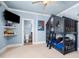 A ' bedroom includes a custom bunk bed, playful decor, and an adjacent bathroom at 3829 Westbury Lake Dr, Raleigh, NC 27603