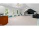 A bonus room features an entertainment center, storage, and lots of windows at 3829 Westbury Lake Dr, Raleigh, NC 27603