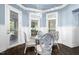 Charming breakfast nook with wainscoting, chandelier, and views to the exterior at 3829 Westbury Lake Dr, Raleigh, NC 27603