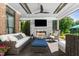 Outdoor living space with cozy seating, a fireplace, and a view of the lake and pool at 3829 Westbury Lake Dr, Raleigh, NC 27603