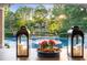 Beautiful pool area with water features and landscaping, seen from covered veranda at 3829 Westbury Lake Dr, Raleigh, NC 27603
