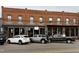 Charming brick building with street-level storefronts offering a variety of shops and boutiques in Franklinton at 4420 W River Rd, Franklinton, NC 27525