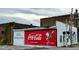 Charming vintage Coca-Cola mural painted on an old building near the Historic Downtown of Franklinton at 4420 W River Rd, Franklinton, NC 27525