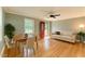 Charming living room with hardwood floors, a dining table, and comfortable sofa at 4420 W River Rd, Franklinton, NC 27525