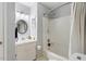 Clean bathroom with tub/shower and white vanity with decorative tile surround at 4953 Tuckahoe Trce, Wake Forest, NC 27587