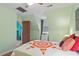 Bedroom featuring a ceiling fan, window, and view into another room with shelves at 4953 Tuckahoe Trce, Wake Forest, NC 27587