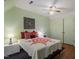 Bedroom features a ceiling fan, parquet floors and decorative red and orange accents at 4953 Tuckahoe Trce, Wake Forest, NC 27587