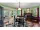 Cozy dining room featuring hardwood floors and a stylish black and white floral rug at 4953 Tuckahoe Trce, Wake Forest, NC 27587