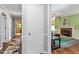 Hallway view leading to a living room with a charming brick fireplace at 4953 Tuckahoe Trce, Wake Forest, NC 27587