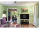 Open living room with a seamless view to a dining area and an outside patio at 4953 Tuckahoe Trce, Wake Forest, NC 27587