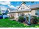 Pleasant backyard showcasing a screened-in porch, a neat lawn, and manicured shrubs at 5045 Homeplace Dr, Apex, NC 27539