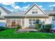 Inviting backyard featuring a screened-in porch, patio area, and lush lawn at 5045 Homeplace Dr, Apex, NC 27539