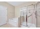 Bathroom with a shower, separate tub, and linen closet at 5045 Homeplace Dr, Apex, NC 27539