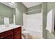 Standard bathroom featuring a vanity with storage, toilet and shower/tub combo at 5045 Homeplace Dr, Apex, NC 27539