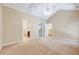 This large bedroom has natural light, a ceiling fan and leads to bathroom and closet areas at 5045 Homeplace Dr, Apex, NC 27539